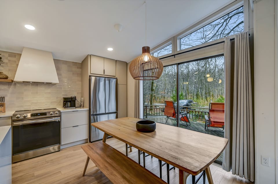Plenty of seating for six at the dining table, with extra space at the island