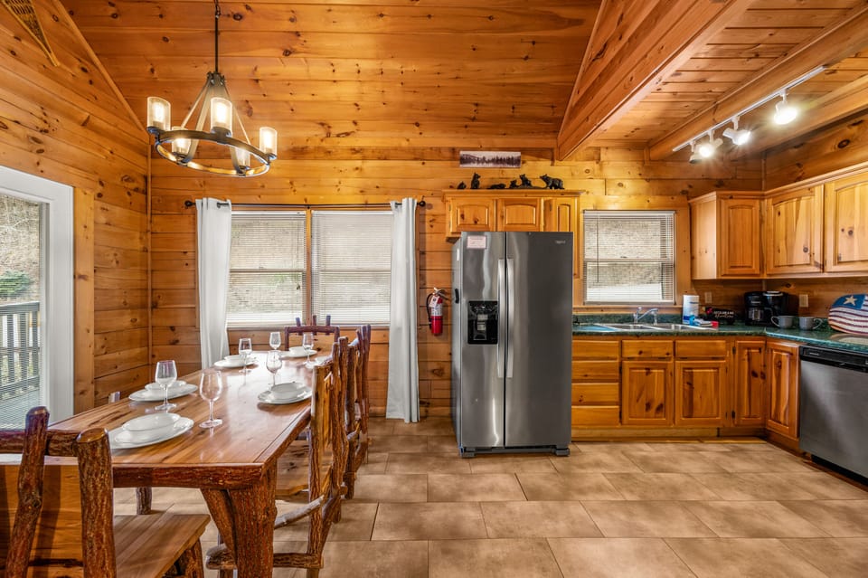 The kitchen is fully equipped with pots, pans, bakeware, dishes, and utensils.
