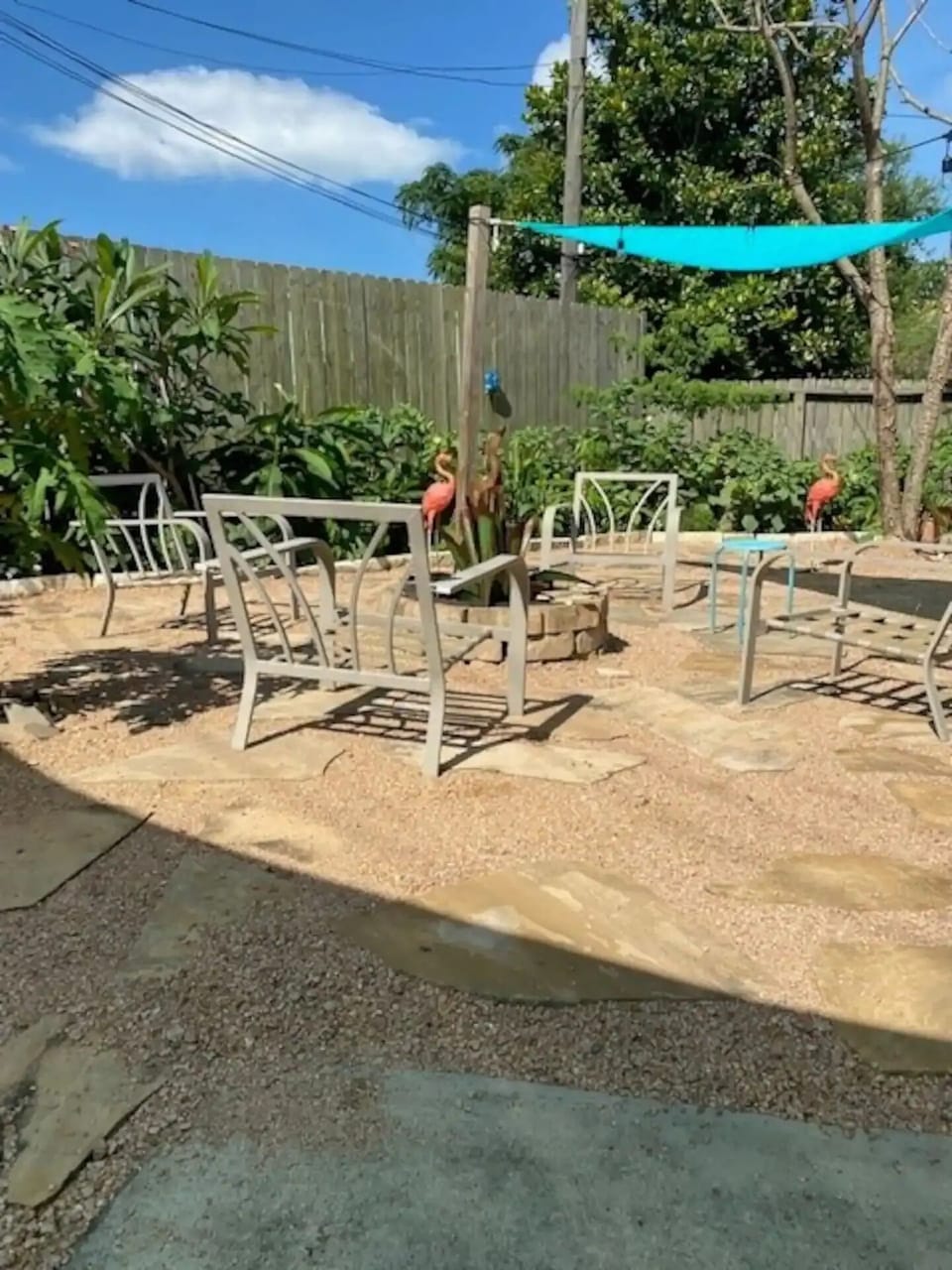 Back yard with fire pit. Seat cushions are available.
