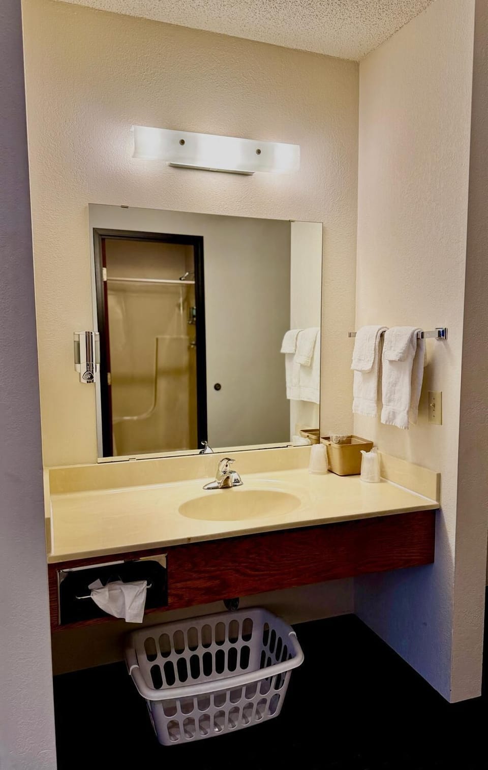 Each room includes a convenient sink area with mirror and fresh towels outside the bathroom, making it easy to get ready. Hair dryers are also available upon request.