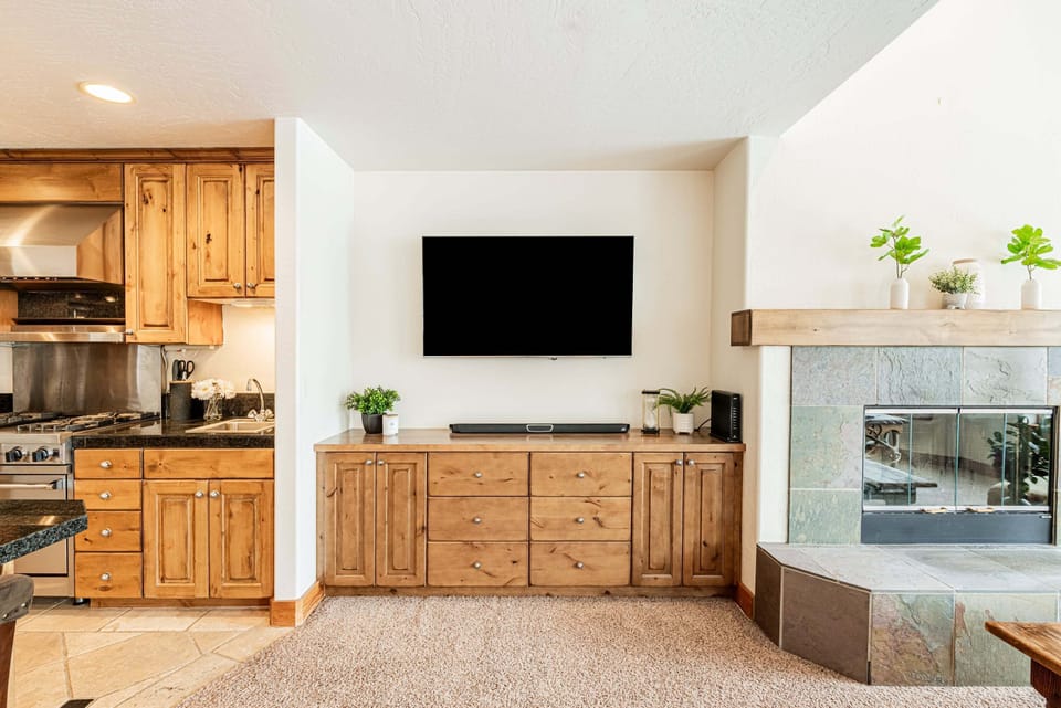 55" Smart TV with a soundbar and cable