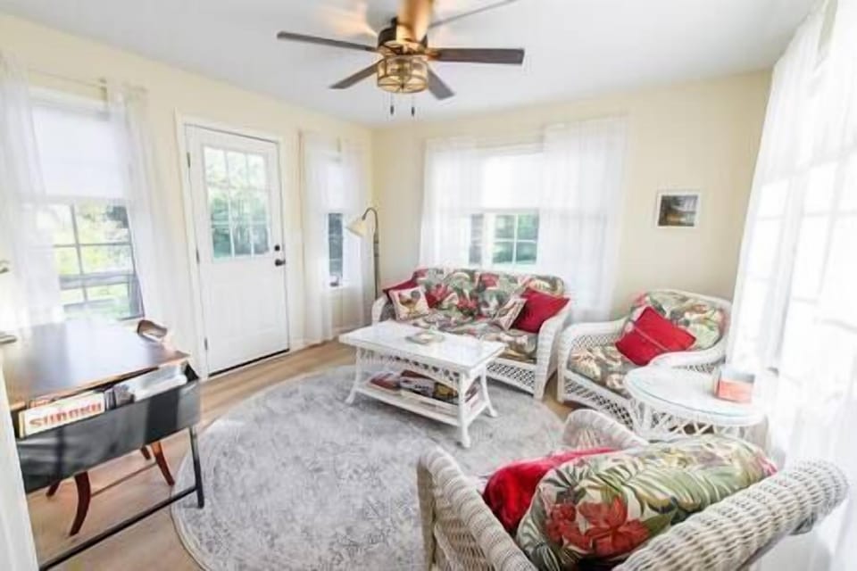 The sunroom off of the 1st floor bedroom brings in wonderful light in the morning. 
