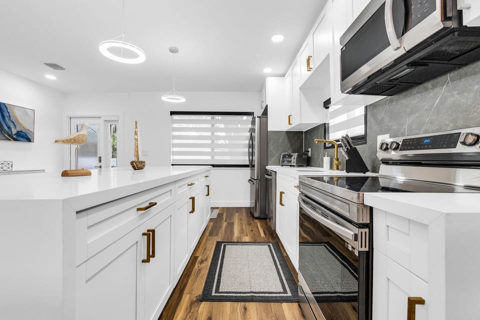 Fully remodeled kitchen with appliances, pots/pans, cooking utensils, etc