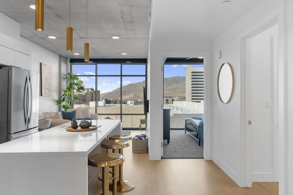 View of kitchen and cozy living room.