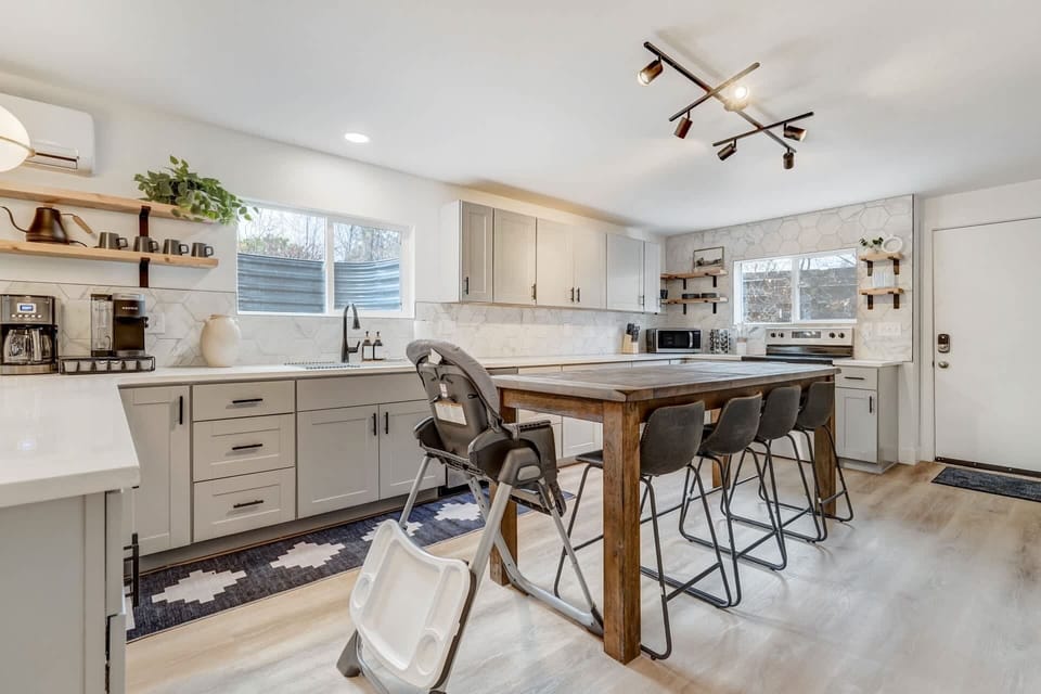 Gather around our dining table, perfect for enjoying meals and conversations. The inviting setting ensures every meal is a delightful experience, creating moments to savor.