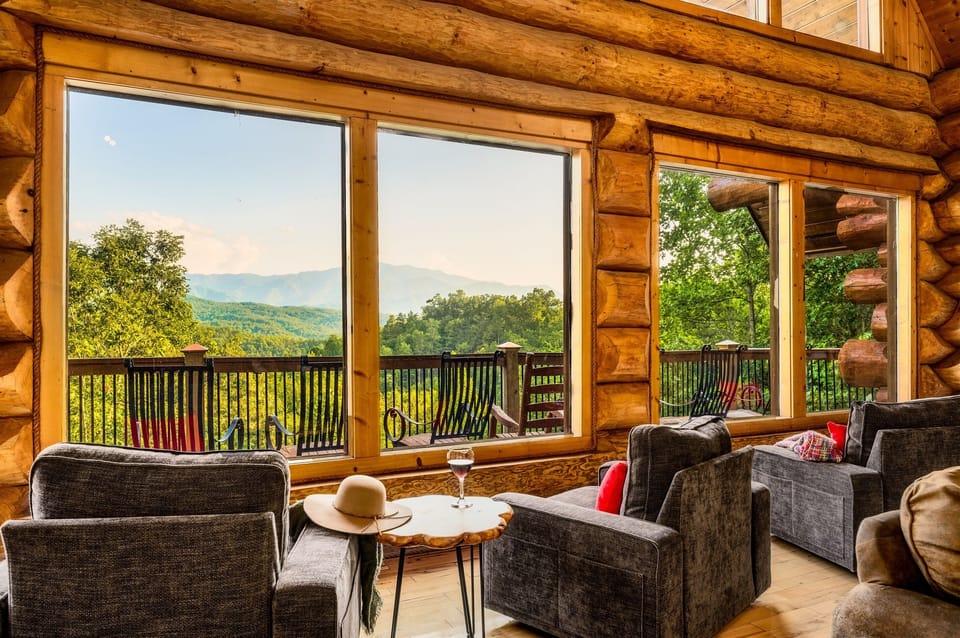 This gorgeous custom large-log cabin is a spacious sanctuary, boasting vaulted ceilings across its 6129 sqft.