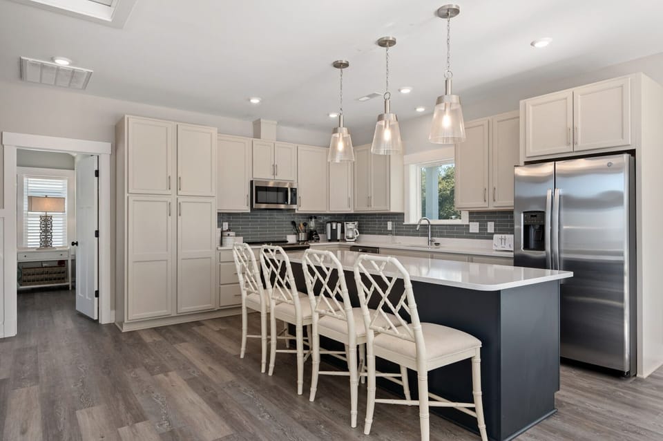 Kitchen with Bar Stool Seating on Third Level