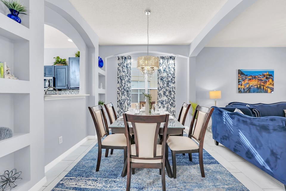 Luxury Dining Area of the Home in Kissimmee Florida - 6 Persons Dining - Thoughtful lighting fixtures creating an intimate and inviting atmosphere - Lots of art work and beautiful furnishings throughout the home