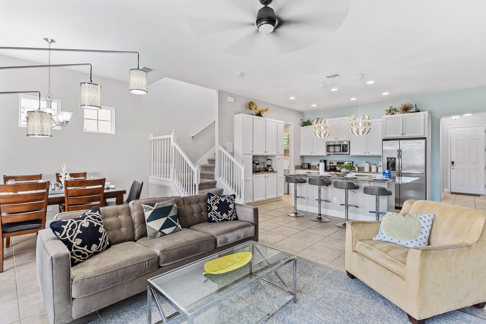 Beautiful Townhouse in Davenport Florida - Open layout seamlessly connecting the dining area to the kitchen and living room - Chic area with a statement lighting - Customized decor reflecting a sophisticated design sensibility