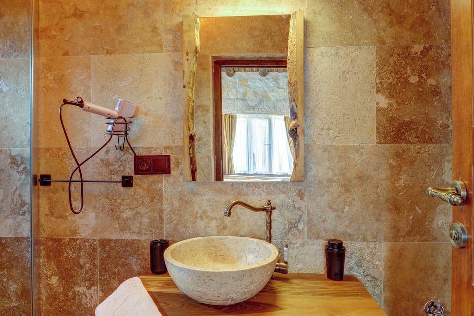 Deluxe Double Room | Bathroom | Hair dryer, slippers, towels, soap