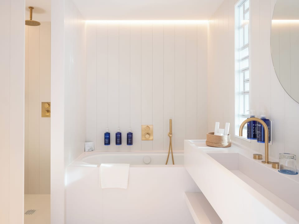 Designer toiletries, hair dryer, bathrobes, slippers