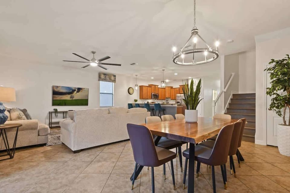 A cozy dining area bathed in warm light, featuring a charming table setup perfect for intimate meals and relaxed gatherings.