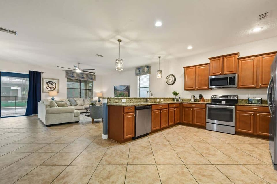 A spacious kitchen with ample counter space, modern appliances, and plenty of room for cooking and entertaining, creating the perfect environment for culinary creativity and family gatherings.