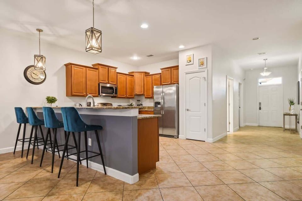 A sleek countertop kitchen with modern finishes, featuring spacious surfaces for meal prep, stylish appliances, and an organized layout that makes cooking both efficient and enjoyable.