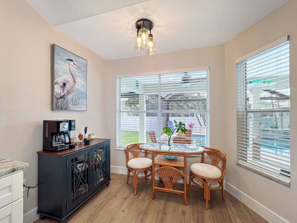 Fully stocked coffee bar with a table for two.