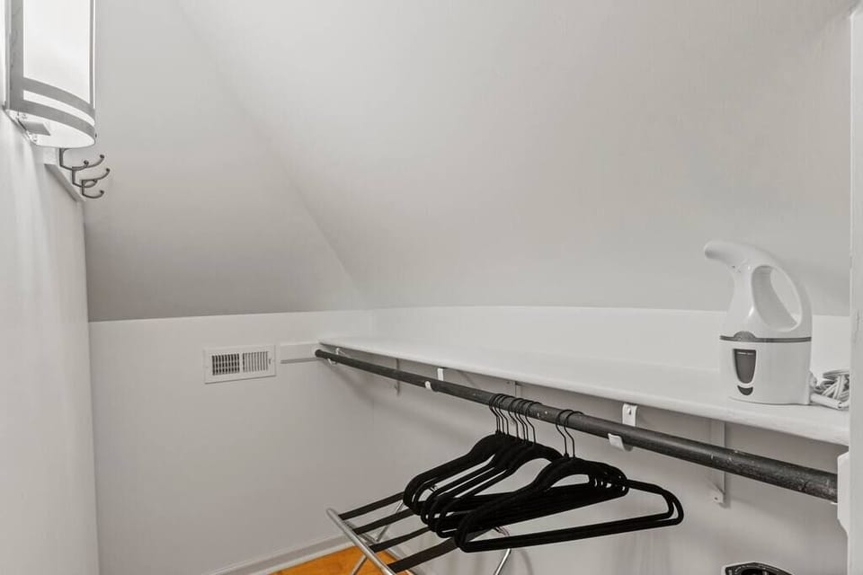 Walk in closet with plenty of space for luggage and hang ups