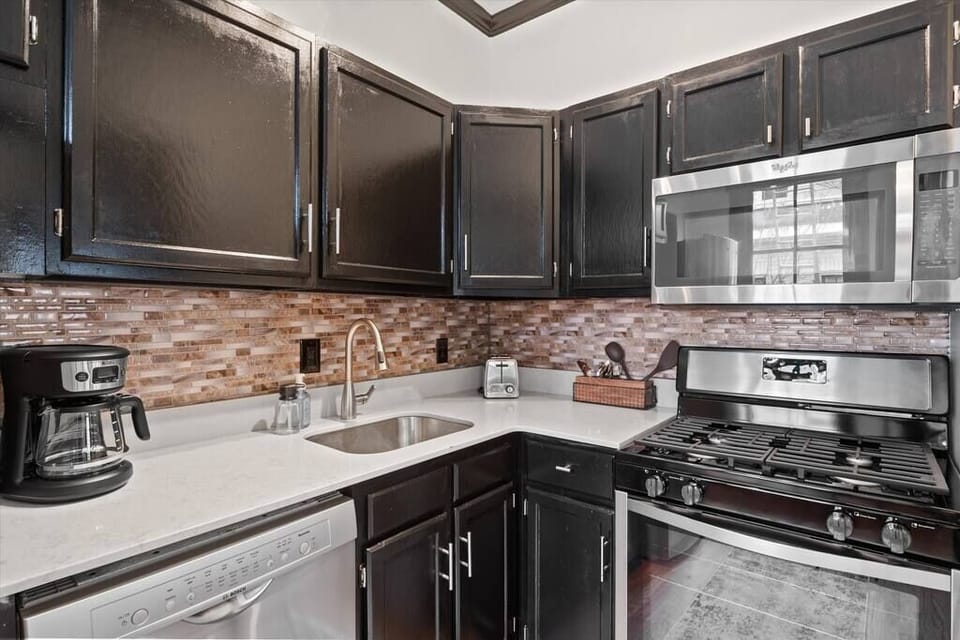 Apartment features a gas range, dishwasher, full size fridge & microwave