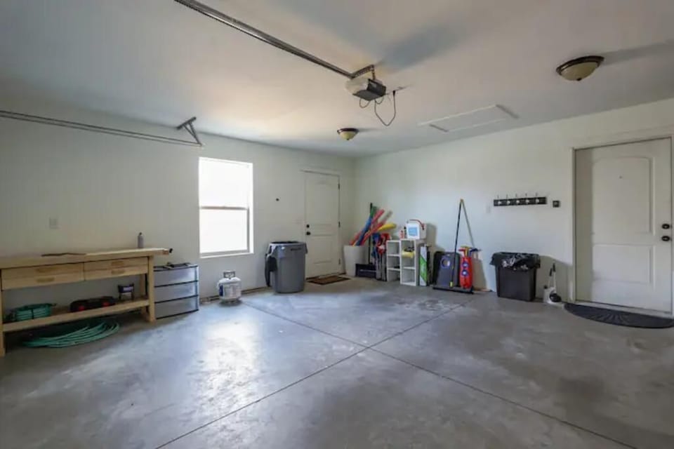 Two car garage that leads into mud/laundry room