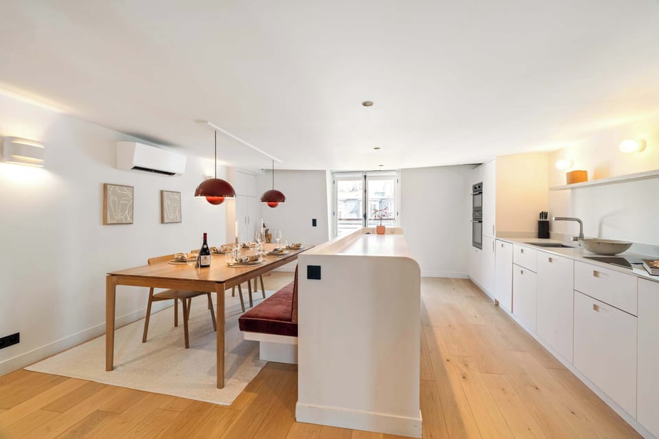 Dining table seats eight and doubles as a functional workspace.