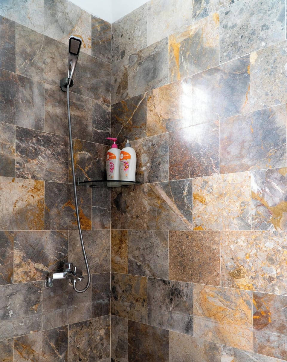Economy Double Room | Bathroom | Shower, designer toiletries, hair dryer, slippers