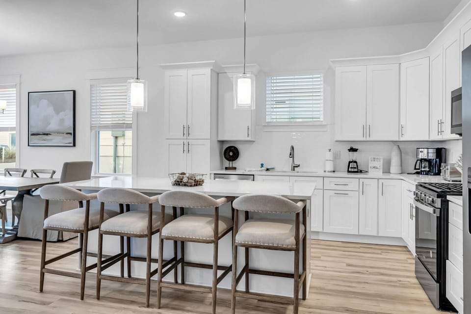 Well appointed open concept kitchen and dining area with seating for 12