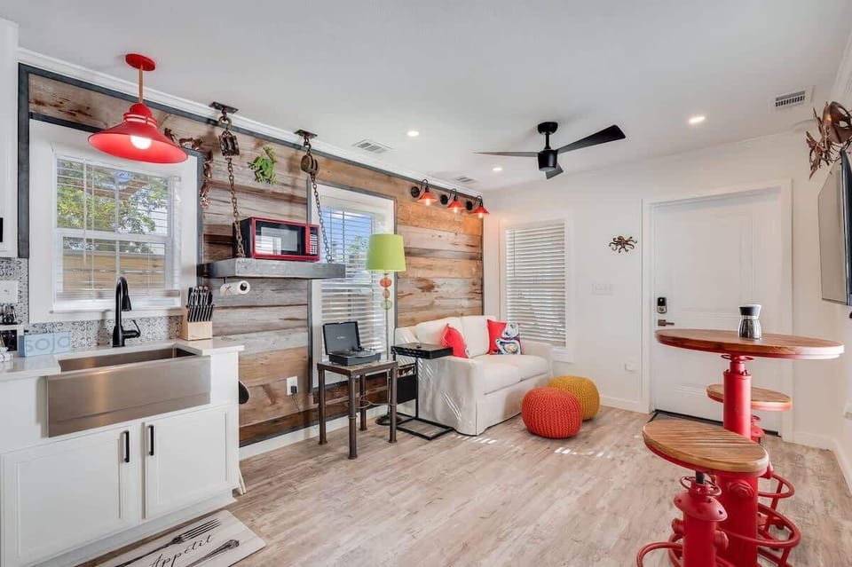 - Whimsical and welcoming, this space invites you to unwind, work, or dine in style - High top bar seating, cheerful lighting, and bold textures add character throughout - Ideal for solo stays or couples who love a space with personality