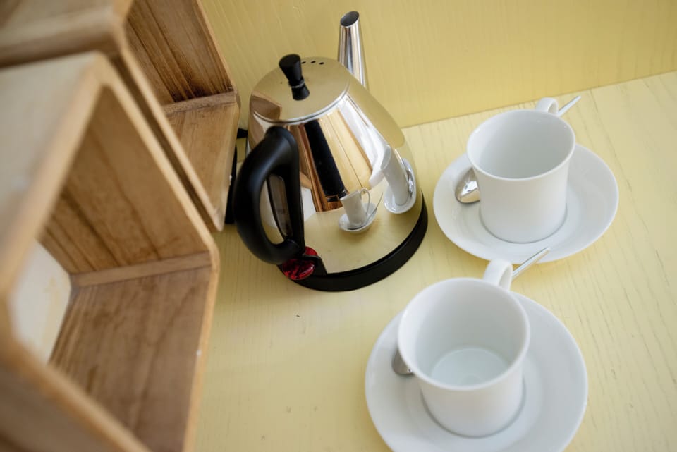 Queen Room - ground floor | Minibar, in-room safe, iron/ironing board, free WiFi