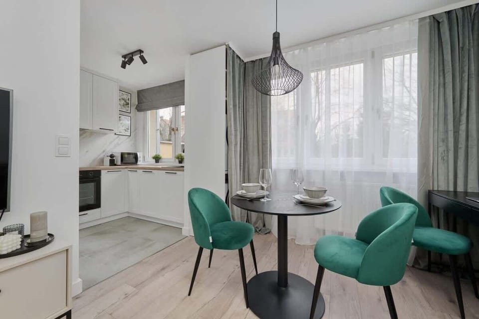 Another perspective of the dining space, featuring open shelving and decorative pieces.
