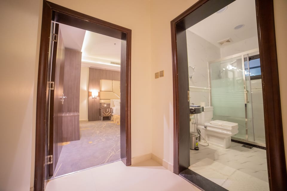 Suite, 2 Bedrooms | Bathroom | Combined shower/tub, rainfall showerhead, designer toiletries