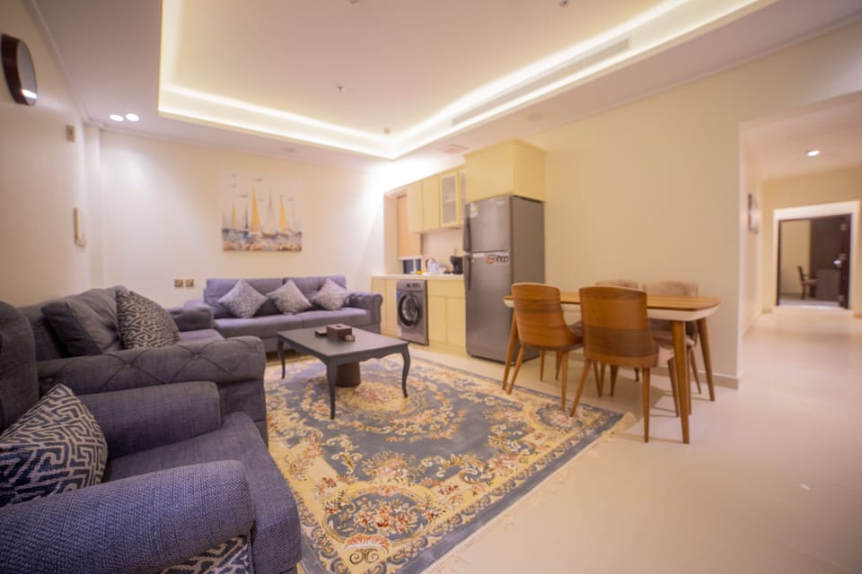 Junior Suite, 2 Bedrooms | Living area | 1-inch TV with satellite channels