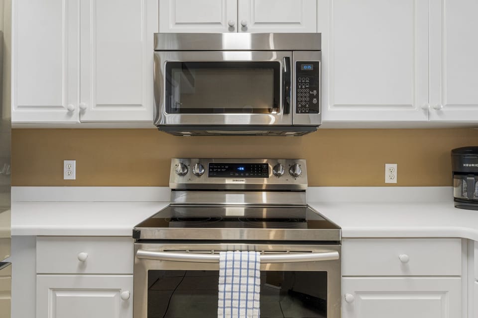 The fully equipped kitchen features stainless-steel appliances, and everything you need to cook meals for family and friends.