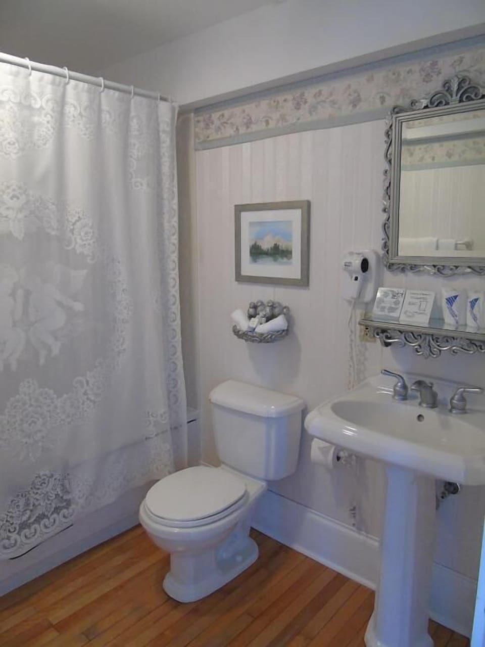 Bathtub, slippers, towels, toilet paper