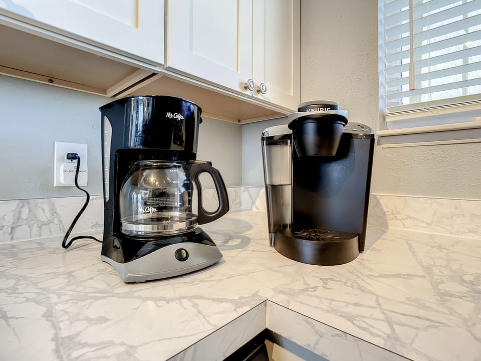 Start your mornings with a fresh brew from the coffee station featuring Keurig and drip coffee makers.
