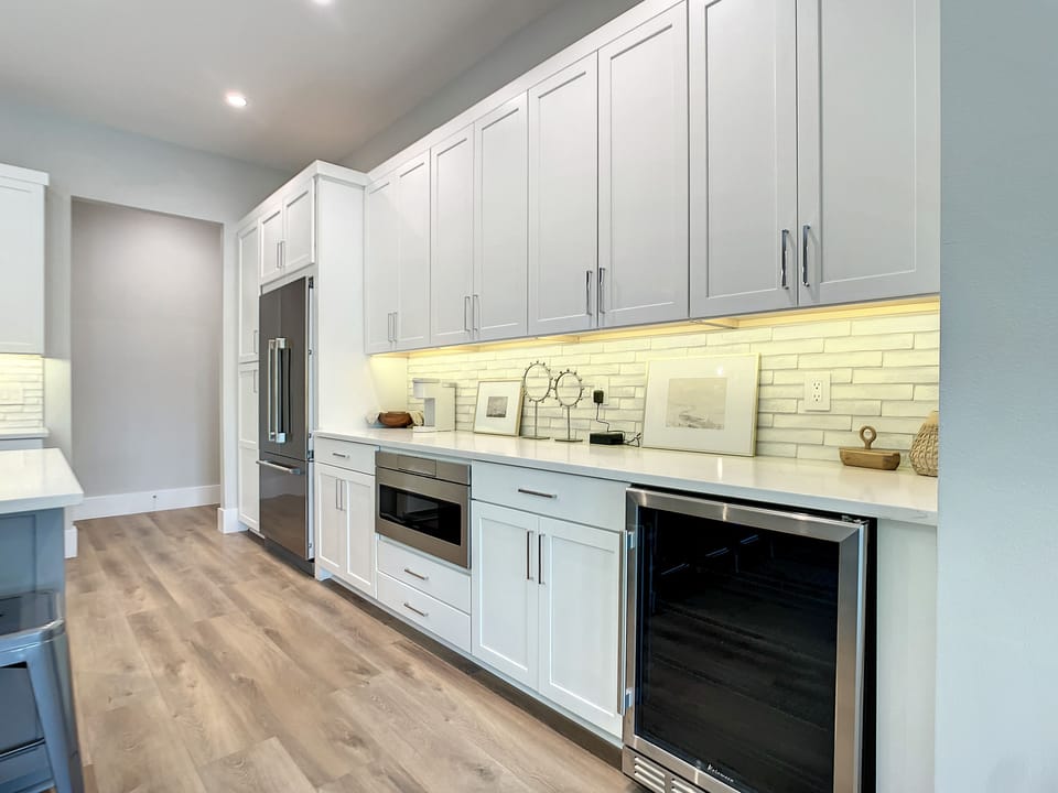 Our open kitchen with a generous island invites you to create, connect, and indulge in the comforts of home.