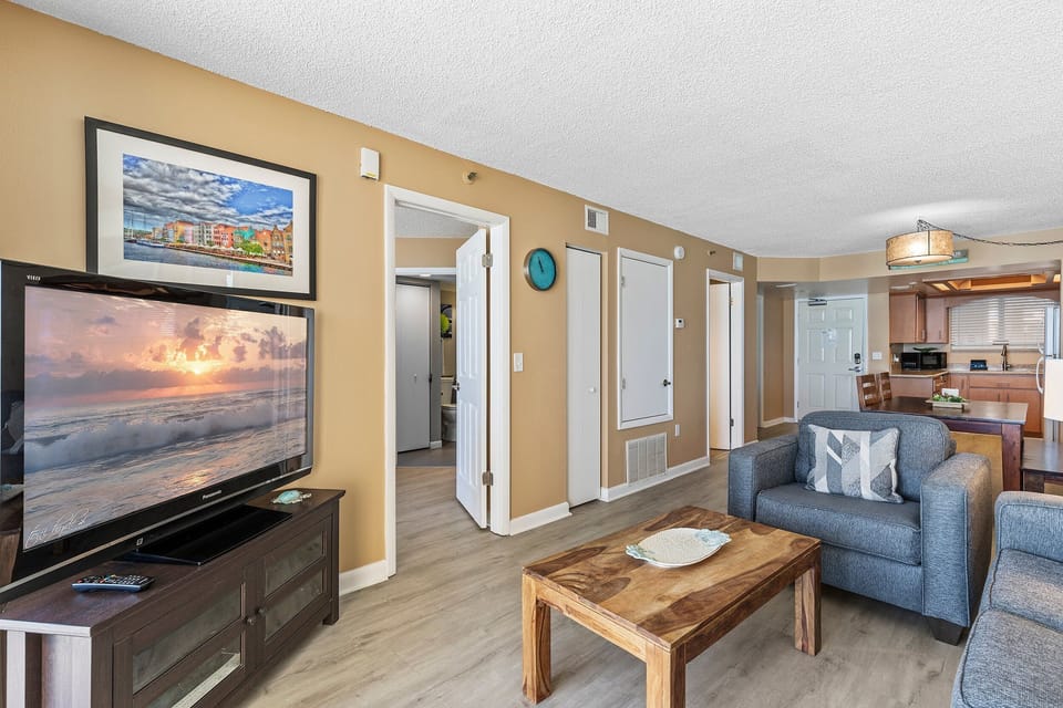 Comfortable seating and a large TV create the perfect spot to unwind after a day at the beach.