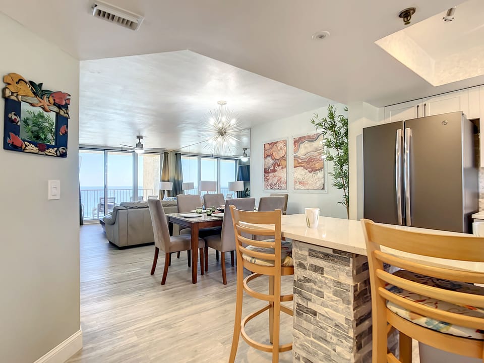 A seamless layout connecting the kitchen, dining, and living spaces, perfect for entertaining and relaxation.
