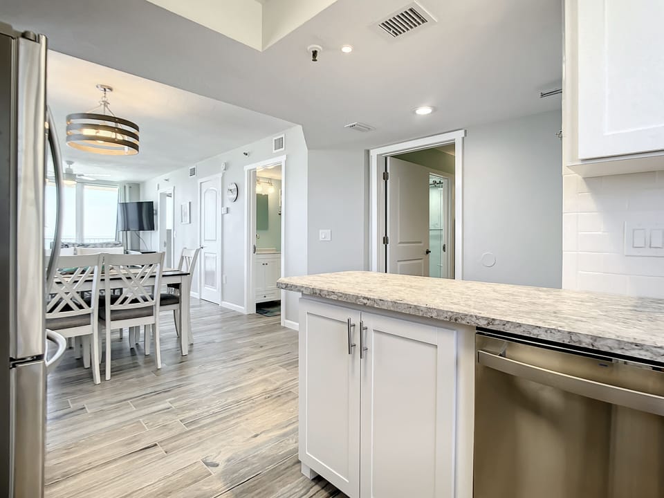 Spacious kitchen connected to dining area, perfect for family meals and gatherings.
