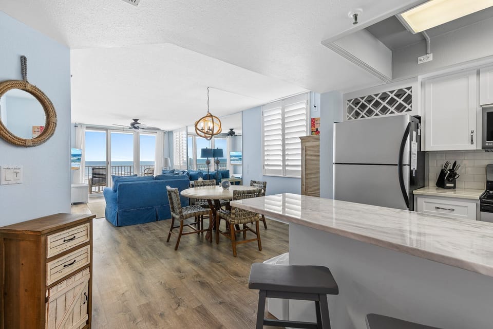 Enjoy the comfort of our open kitchen, dining, and living room combo, perfect for cozy gatherings.