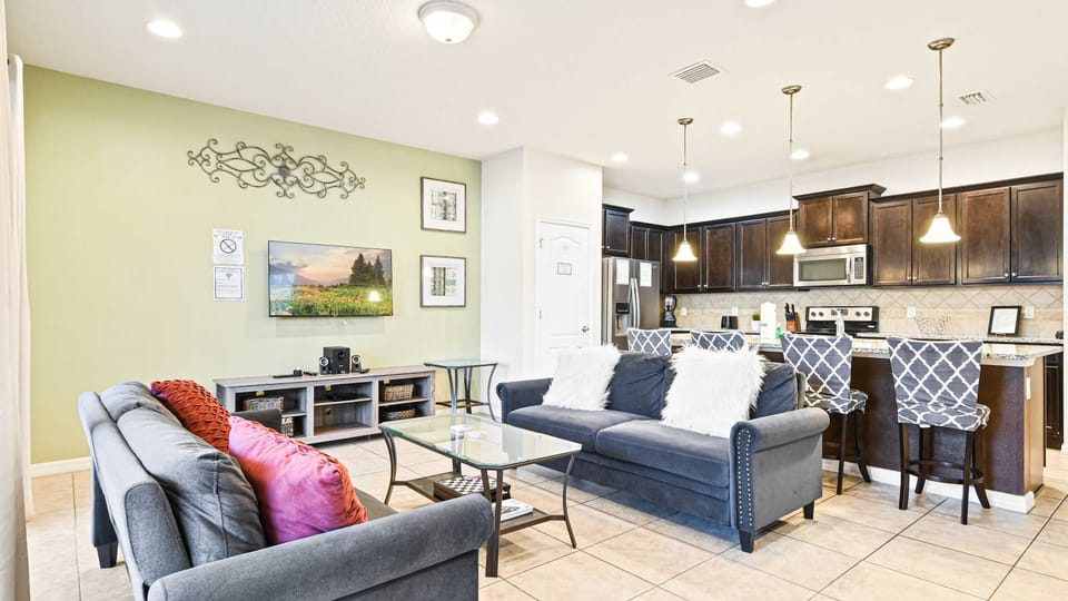 Enjoy quality time with loved ones in our inviting living room, offering a cozy space for relaxation.
