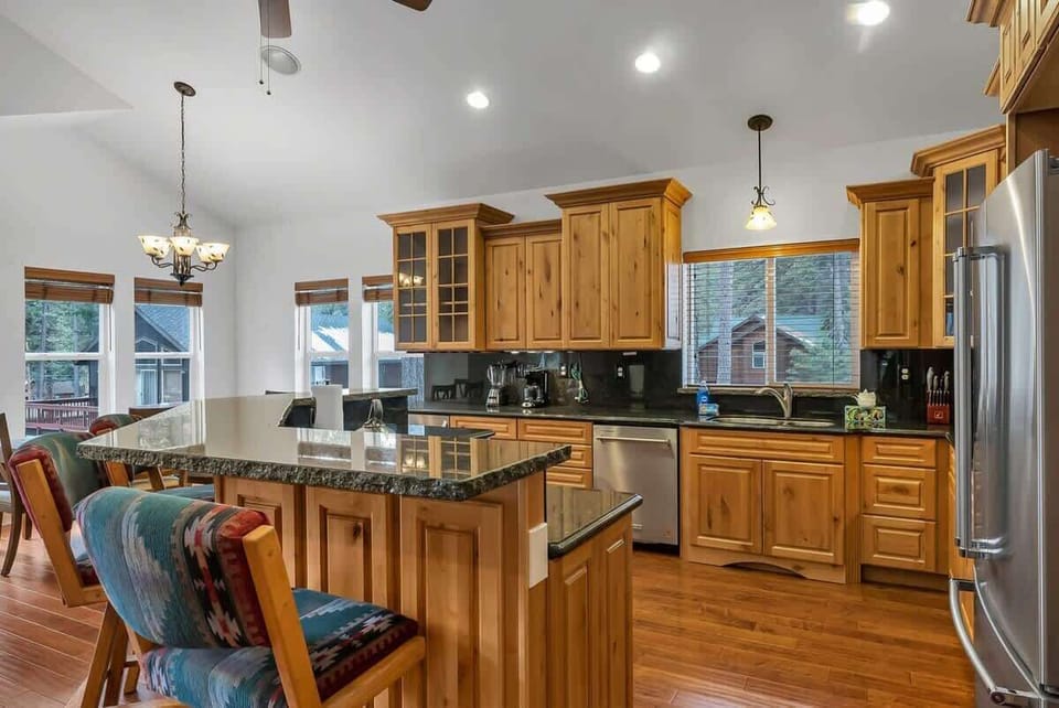 The spacious kitchen features ample cabinet and counter space, like new stainless steel appliances, and all the basic cookware to whip up some delicious meals at home easily.