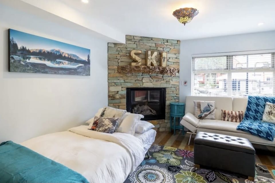 Make up these sofa beds to face the beautiful fireplace and wall mounted tv.