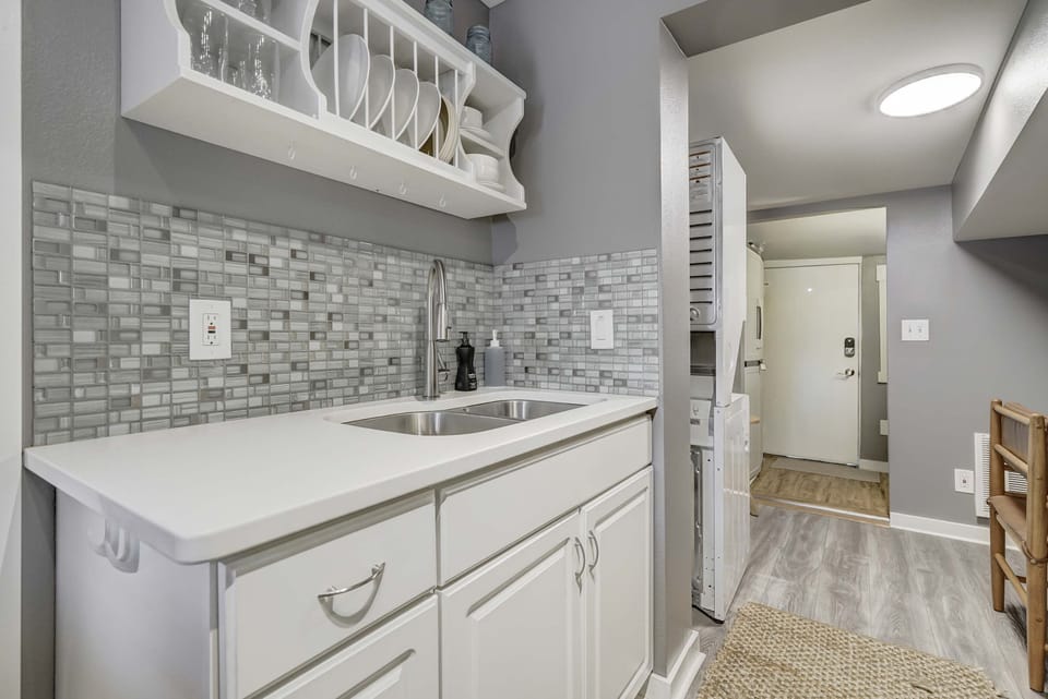 Experience Culinary Comfort! Our Spacious Kitchen is Conveniently Located, Just Steps Away from the Living Room and Bedrooms. Enjoy the Ease and Comfort of This Open Layout.