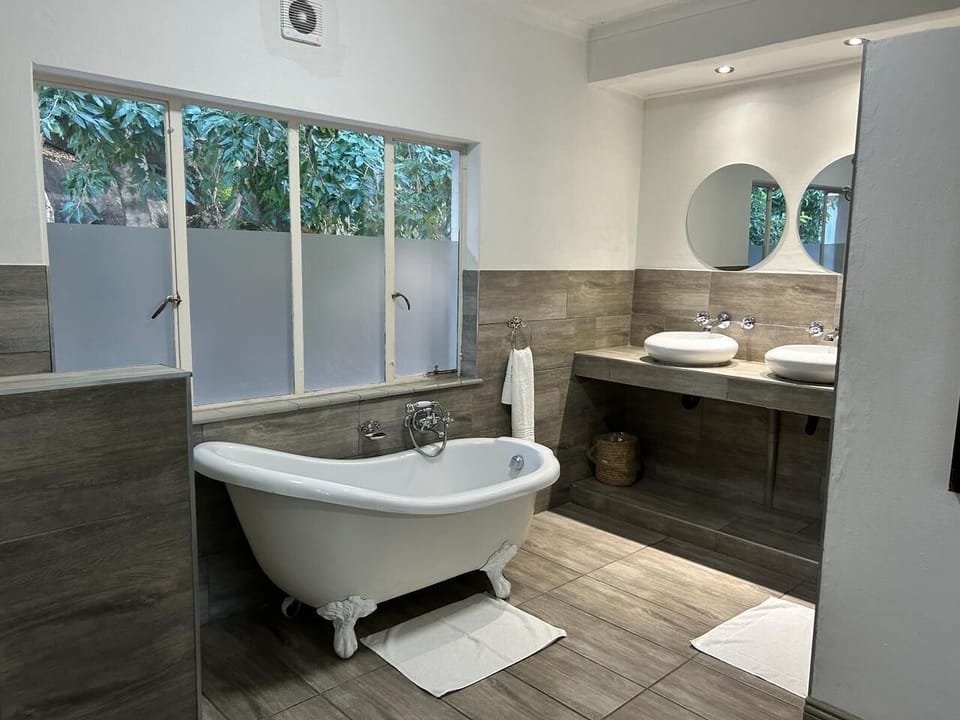 Room 5 Family Suite | Bathroom | Separate tub and shower, deep soaking tub, rainfall showerhead, towels