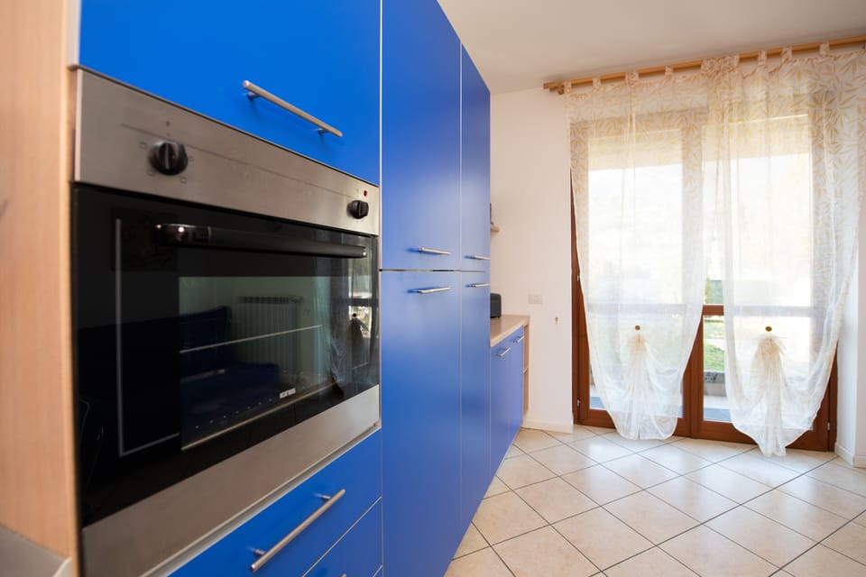 Comfort Apartment | Private kitchen | Full-size fridge, microwave, oven, coffee/tea maker