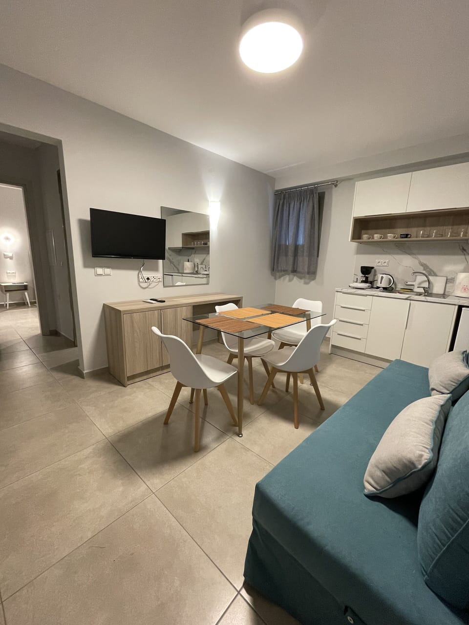 Comfort Apartment | Living area | 32-inch flat-screen TV with satellite channels