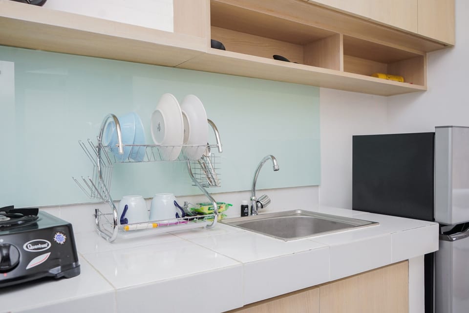 Studio, 1 Queen Bed | Private kitchen | Fridge, stovetop, rice cooker, dining tables