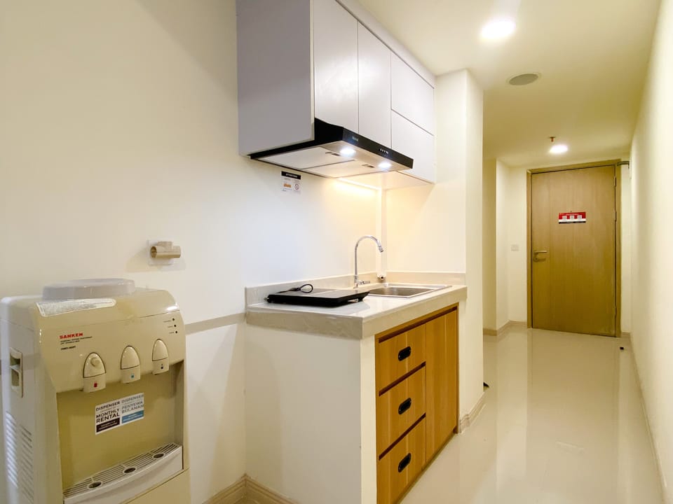 Apartment | Private kitchen | Fridge, stovetop, rice cooker, dining tables
