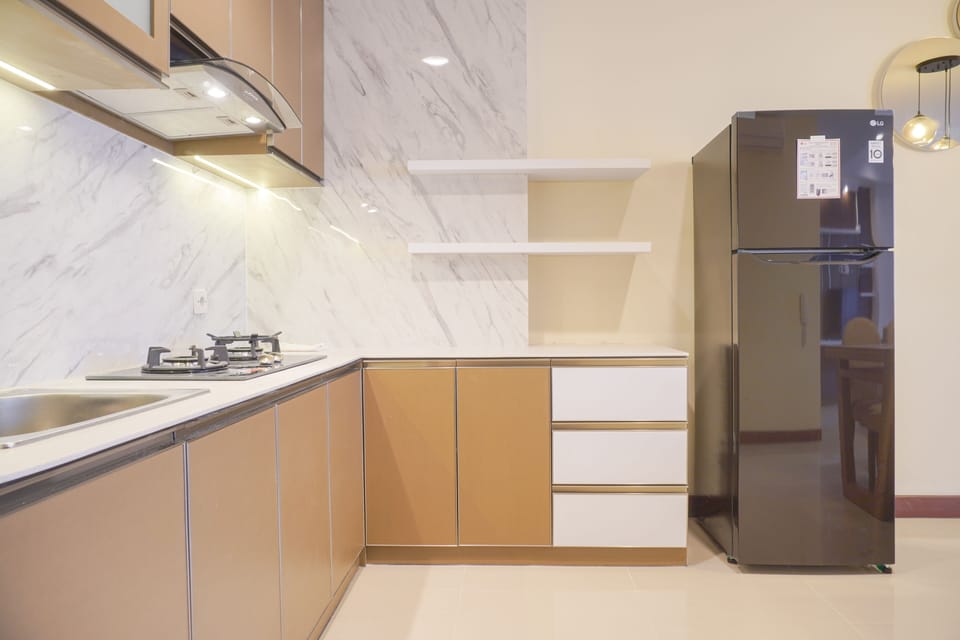 Apartment | Private kitchen | Fridge, stovetop, rice cooker, dining tables