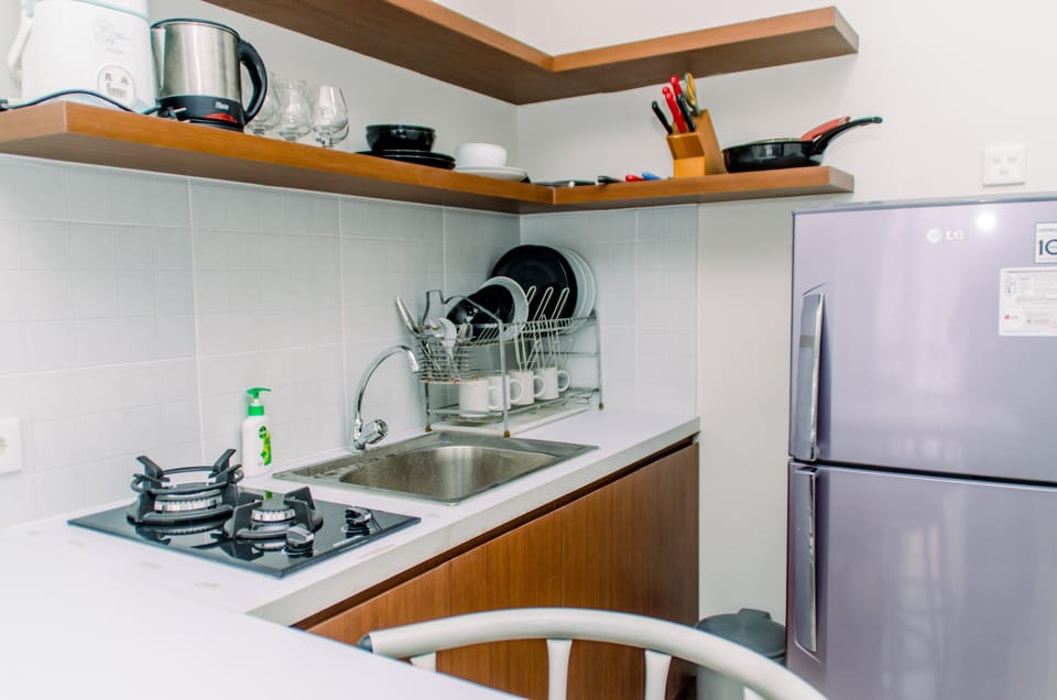Apartment | Private kitchen | Fridge, stovetop, rice cooker, dining tables