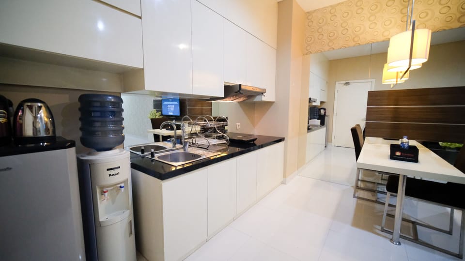 Apartment | Private kitchen | Fridge, stovetop, rice cooker, dining tables